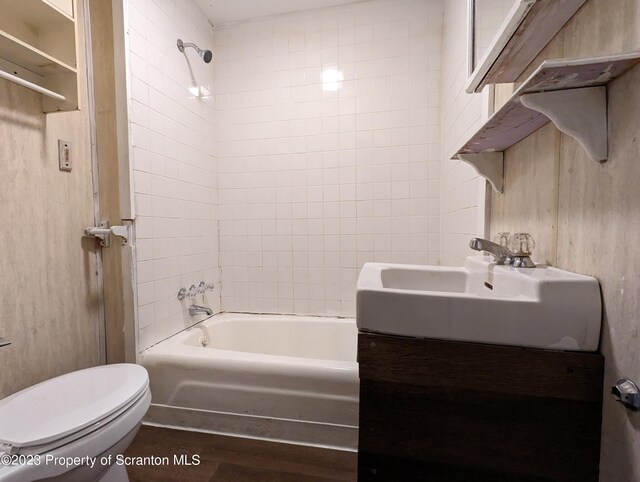 121 Sand St, Dunmore, PA 18510 - bathroom featuring shower / washtub combination, wood finished floors, and vanity