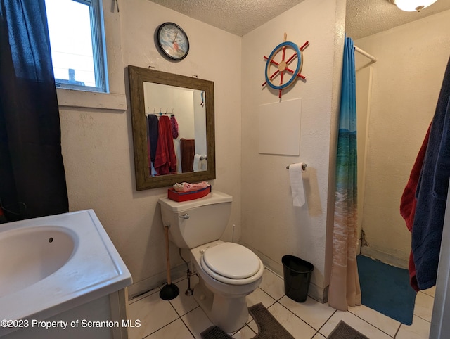 121 Sand St, Dunmore, PA 18510 - bathroom featuring a textured ceiling, tile patterned floors, a shower with curtain, and vanity