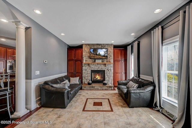 1015 Circle Green Dr Unit L 25, South Abington Twp, PA 18411 - living room with a fireplace, recessed lighting, decorative columns, a wainscoted wall, and a decorative wall
