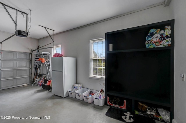 1015 Circle Green Dr Unit L 25, South Abington Twp, PA 18411 - garage with freestanding refrigerator and a garage door opener