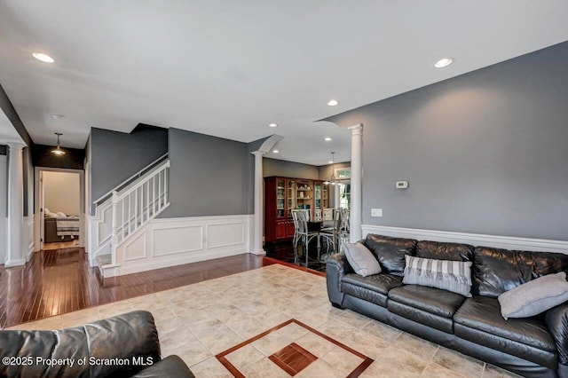 1015 Circle Green Dr Unit L 25, South Abington Twp, PA 18411 - living room with decorative columns, stairway, a wainscoted wall, recessed lighting, and a decorative wall