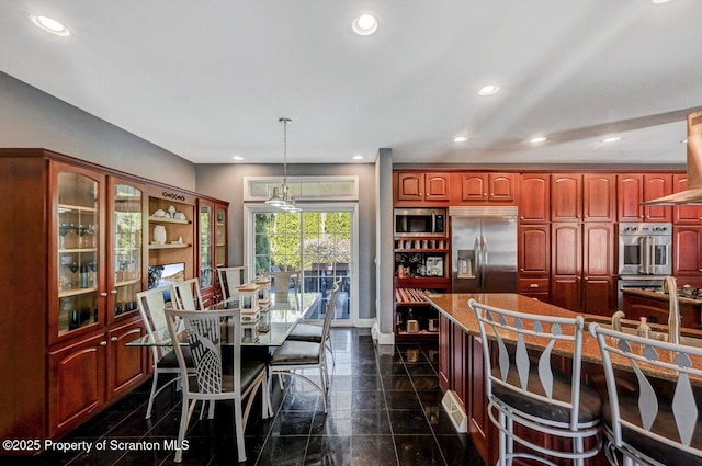 1015 Circle Green Dr Unit L 25, South Abington Twp, PA 18411 - kitchen with built in appliances, granite floors, recessed lighting, dark brown cabinets, and hanging light fixtures