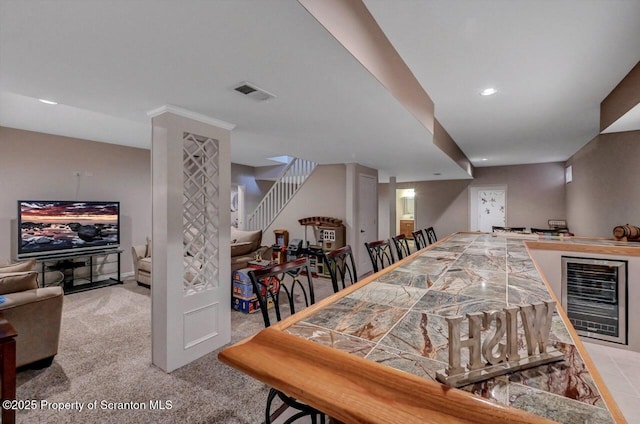 1015 Circle Green Dr Unit L 25, South Abington Twp, PA 18411 - dining room with wine cooler, stairway, light colored carpet, recessed lighting, and bar