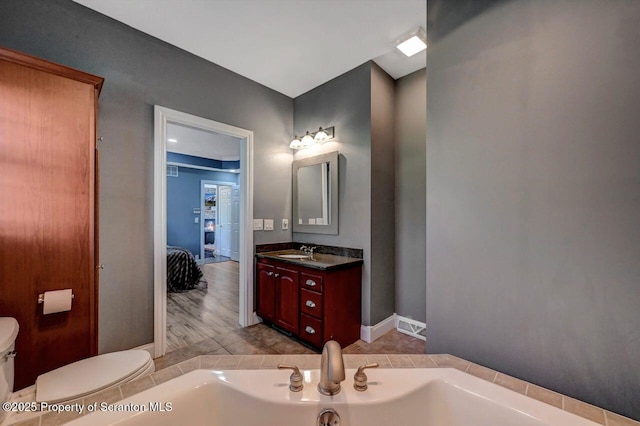 1015 Circle Green Dr Unit L 25, South Abington Twp, PA 18411 - full bathroom featuring a bath, toilet, and vanity