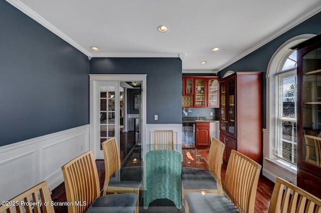 1015 Circle Green Dr Unit L 25, South Abington Twp, PA 18411 - dining room with wet bar, ornamental molding, dark wood-style floors, a wainscoted wall, and recessed lighting