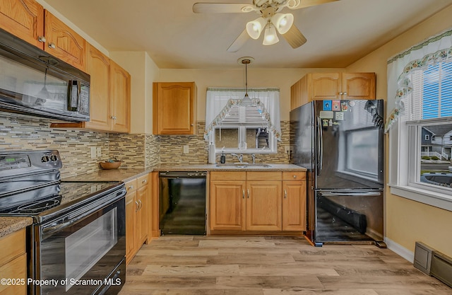 115 Marion St, Old Forge, PA 18518 - kitchen featuring black appliances, a sink, backsplash, ceiling fan, and light wood-style floors