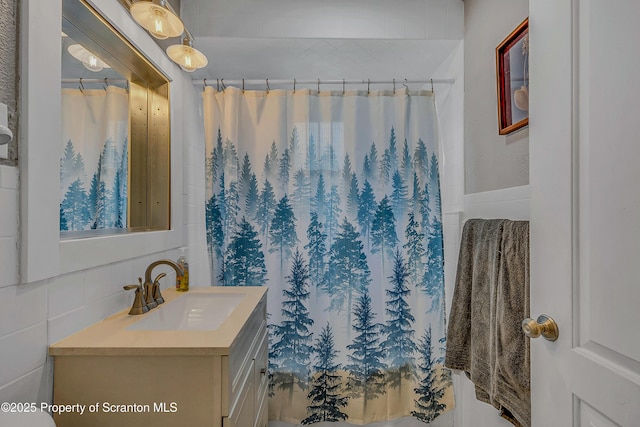 115 Marion St, Old Forge, PA 18518 - bathroom featuring tile walls, vanity, and a shower with curtain