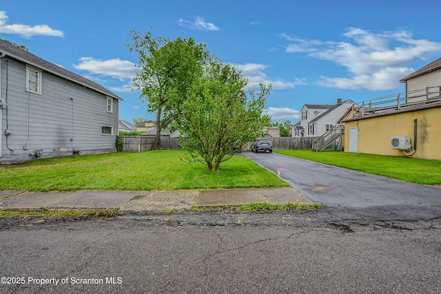115 Marion St, Old Forge, PA 18518 - view of yard with ac unit, a residential view, asphalt driveway, and stairway