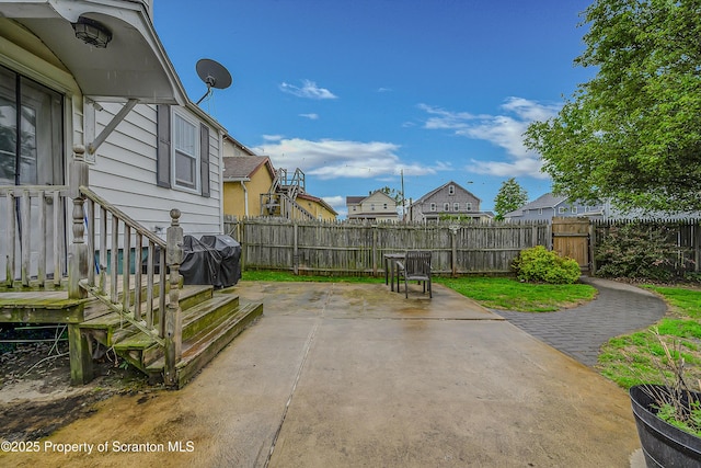 115 Marion St, Old Forge, PA 18518 - fenced backyard featuring grilling area and a patio area
