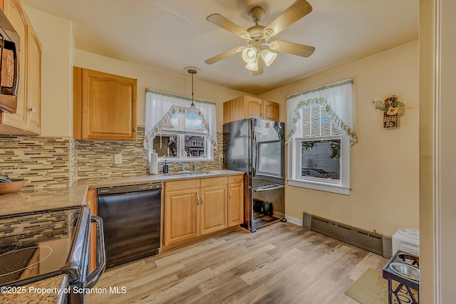 115 Marion St, Old Forge, PA 18518 - kitchen with black appliances, a baseboard heating unit, decorative backsplash, light wood-style floors, and a ceiling fan