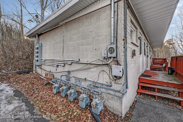 view of property exterior featuring a wooden deck