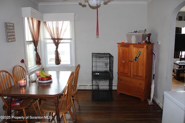 dining area with arched walkways, dark wood finished floors, and crown molding