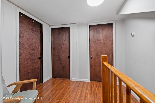 corridor featuring hardwood / wood-style flooring