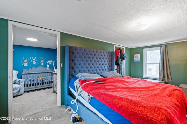 carpeted bedroom with a textured ceiling