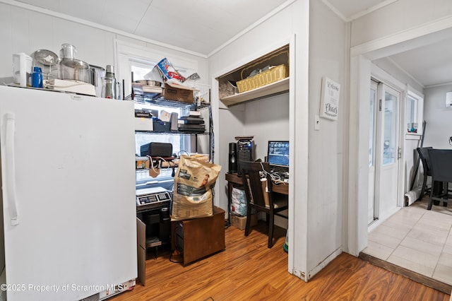 office space with hardwood / wood-style floors, crown molding, and a healthy amount of sunlight