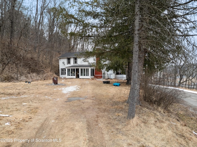 view of front of property featuring a sunroom