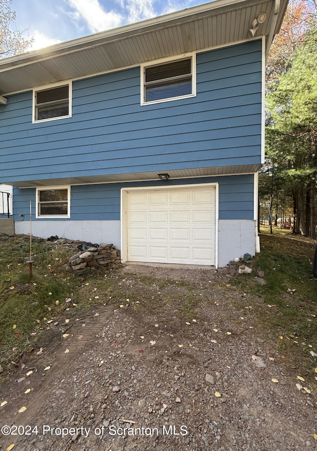 view of property exterior with a garage