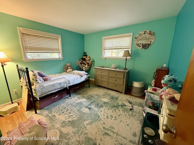 bedroom with light hardwood / wood-style flooring