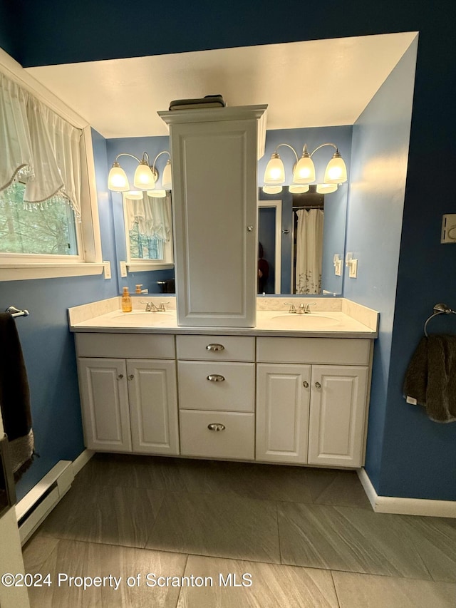 bathroom featuring vanity and a baseboard radiator