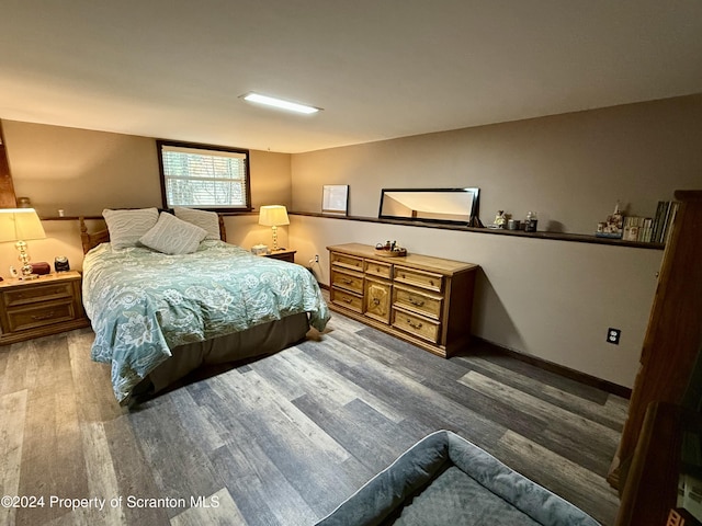 bedroom featuring hardwood / wood-style floors