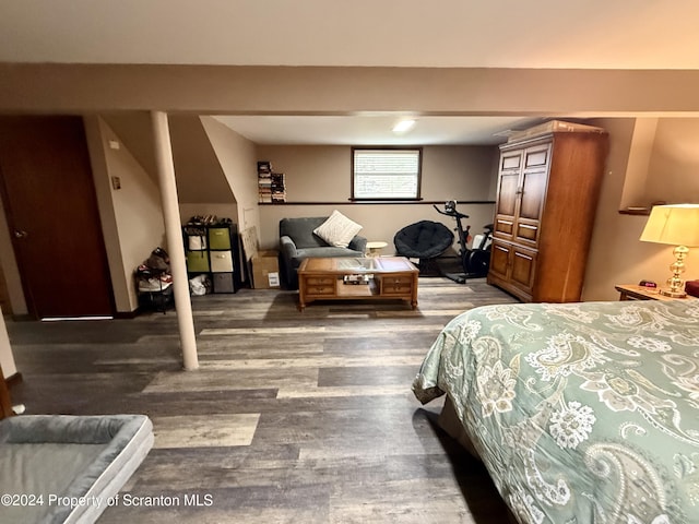 bedroom featuring dark hardwood / wood-style flooring