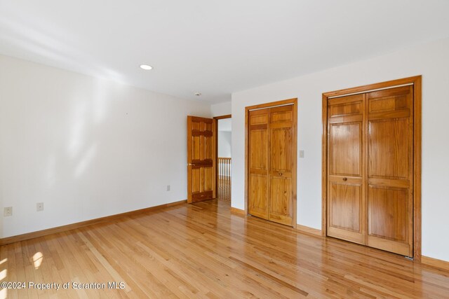 unfurnished bedroom with light hardwood / wood-style floors