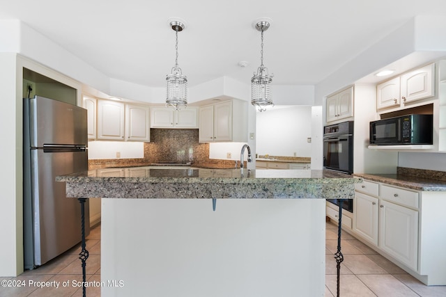 kitchen with backsplash, black appliances, a kitchen breakfast bar, a notable chandelier, and light tile patterned flooring