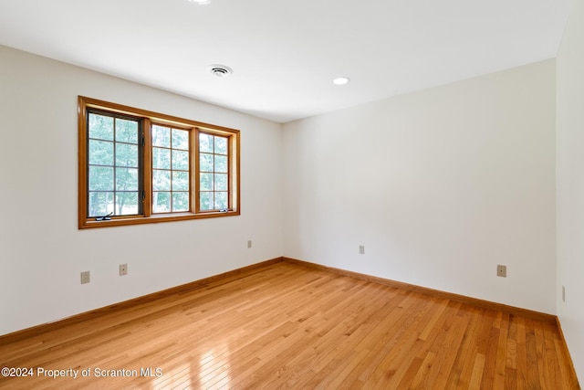 spare room with light wood-type flooring