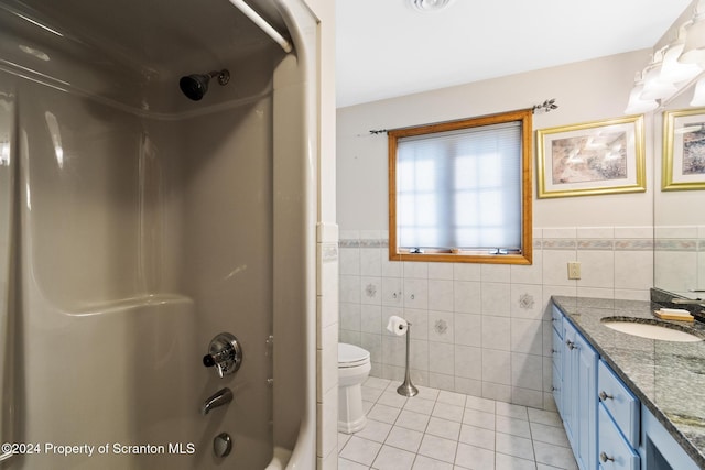 133 Glenmaura Dr, Moosic, PA 18507 - full bathroom featuring tile walls, tile patterned flooring, vanity, a wainscoted wall, and shower / tub combination