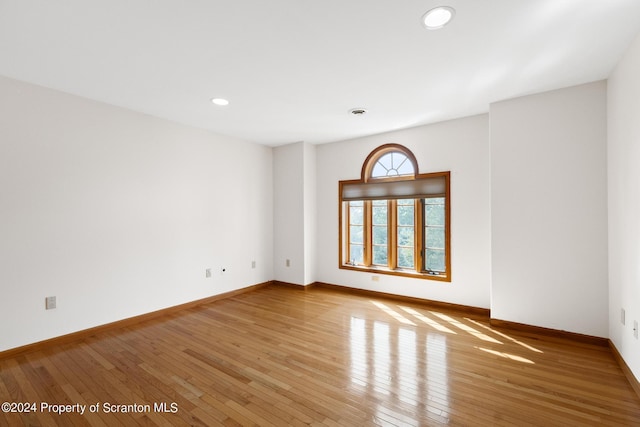 unfurnished room with light hardwood / wood-style floors