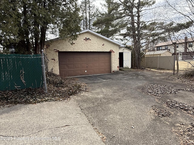 garage featuring fence