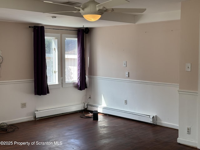 empty room with a baseboard heating unit, wood finished floors, a baseboard radiator, baseboards, and ceiling fan