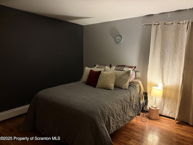 bedroom featuring wood finished floors