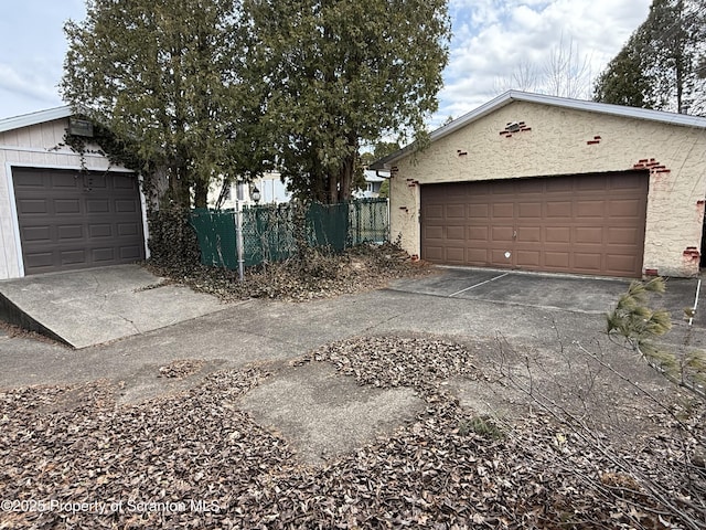 garage with fence