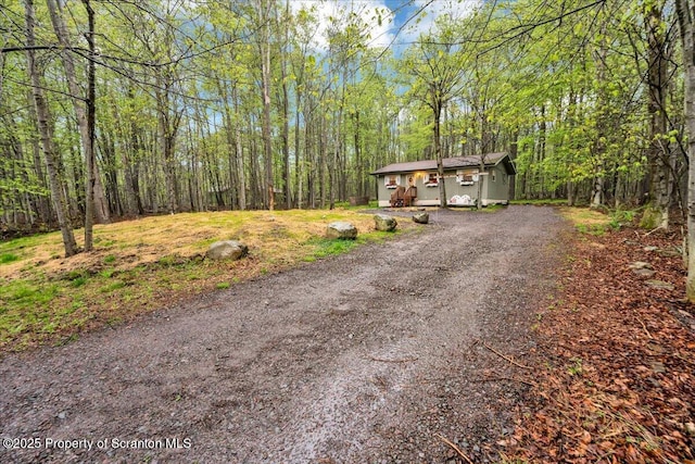 13 S Lehigh River Dr, Clifton Twp, PA 18424 - view of front facade featuring driveway and a view of trees