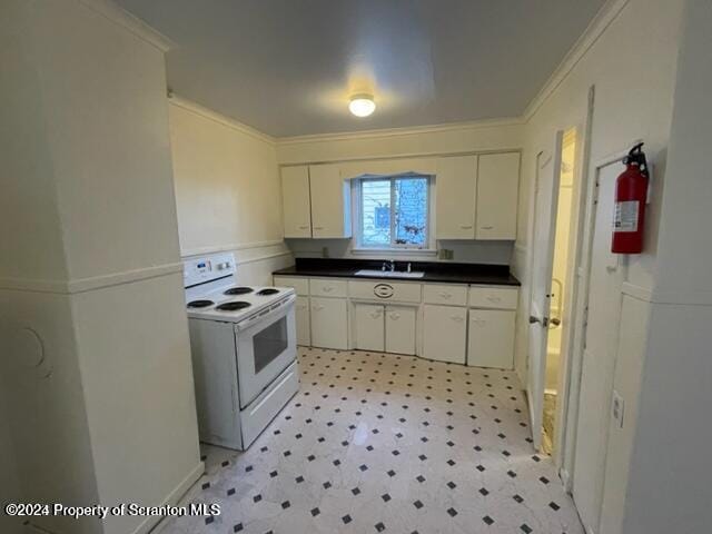 kitchen with white cabinets, white range with electric stovetop, crown molding, and sink