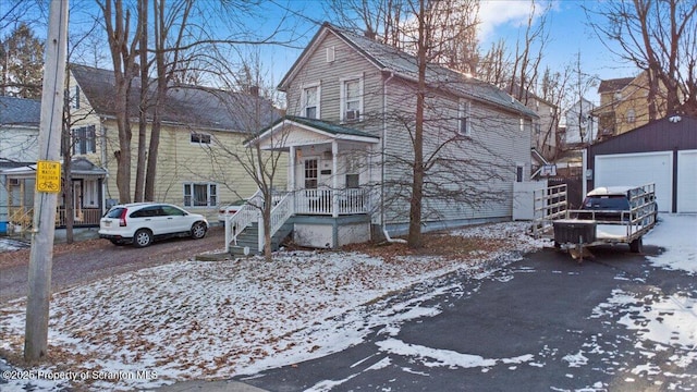 front of property with a garage and an outdoor structure