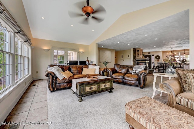 214 Oak St, Dunmore, PA 18512 - tiled living area featuring lofted ceiling, plenty of natural light, a multi sided fireplace, recessed lighting, and a ceiling fan