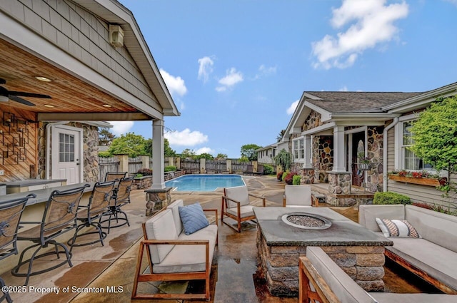214 Oak St, Dunmore, PA 18512 - view of pool featuring an outdoor living space with a fire pit, a patio area, a fenced backyard, and a ceiling fan