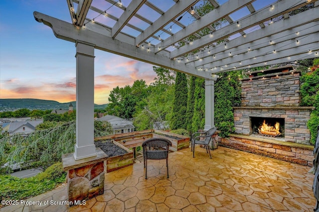 214 Oak St, Dunmore, PA 18512 - view of patio featuring an outdoor stone fireplace