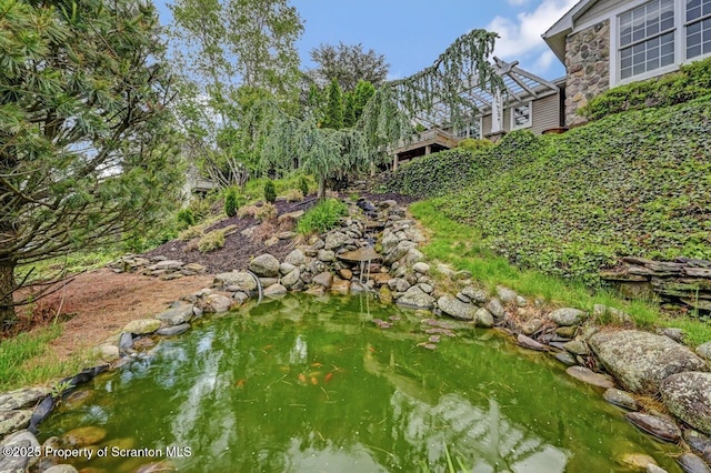 214 Oak St, Dunmore, PA 18512 - view of yard with a small pond