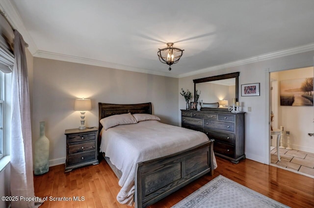 214 Oak St, Dunmore, PA 18512 - bedroom with wood finished floors, crown molding, baseboards, multiple windows, and a chandelier