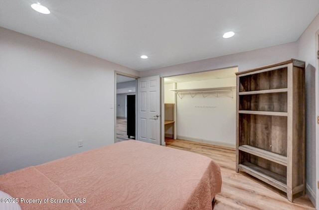 214 Oak St, Dunmore, PA 18512 - bedroom with light wood-style floors, recessed lighting, and a closet