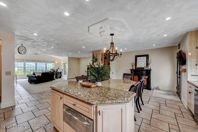 214 Oak St, Dunmore, PA 18512 - kitchen with a warming drawer, a chandelier, recessed lighting, a kitchen island, and baseboards