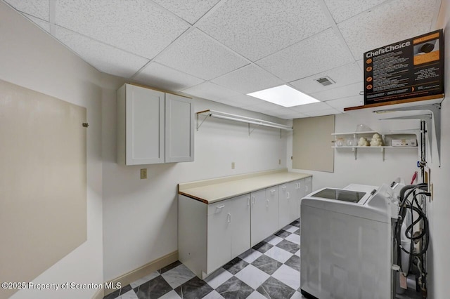 214 Oak St, Dunmore, PA 18512 - laundry room with cabinet space, washing machine and clothes dryer, light floors, and baseboards