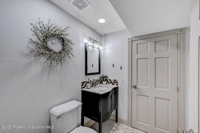 214 Oak St, Dunmore, PA 18512 - bathroom with vanity, toilet, and tile patterned floors