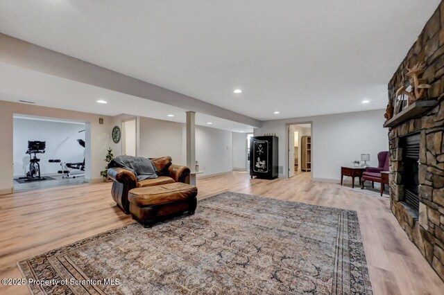 214 Oak St, Dunmore, PA 18512 - living area with a fireplace, light wood-type flooring, and recessed lighting