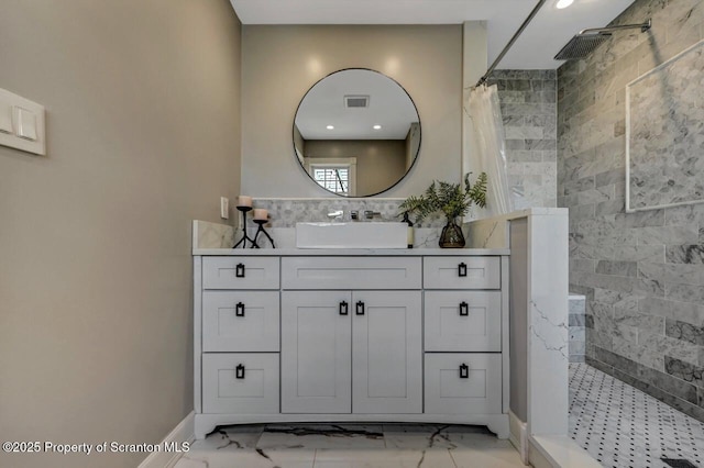 214 Oak St, Dunmore, PA 18512 - bathroom with a walk in shower, vanity, marble look tiles, recessed lighting, and baseboards