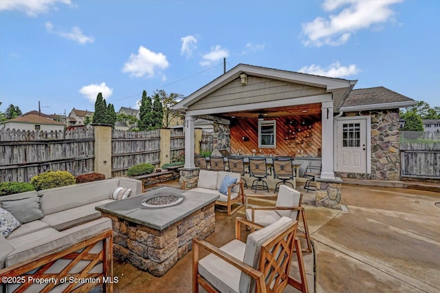 214 Oak St, Dunmore, PA 18512 - fenced backyard featuring an outdoor living space with a fire pit and a patio area