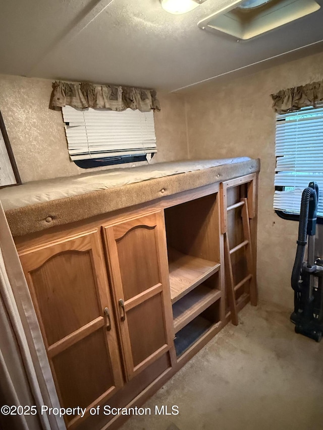 10 Lazy Squaw Trl, Gouldsboro, PA 18424 - kitchen featuring light colored carpet and brown cabinetry